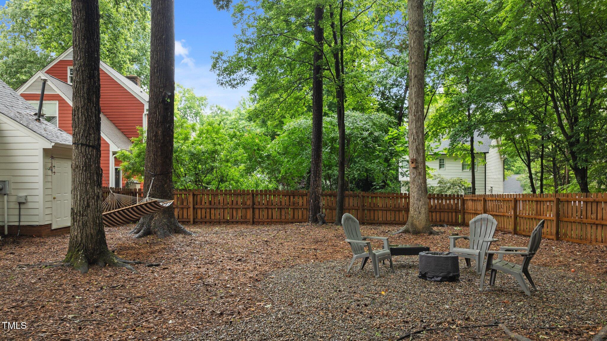 3016 Bolo Trail Raleigh, NC 27615 - Photo 22 of 28 a view of a patio with table and chairs and potted plants