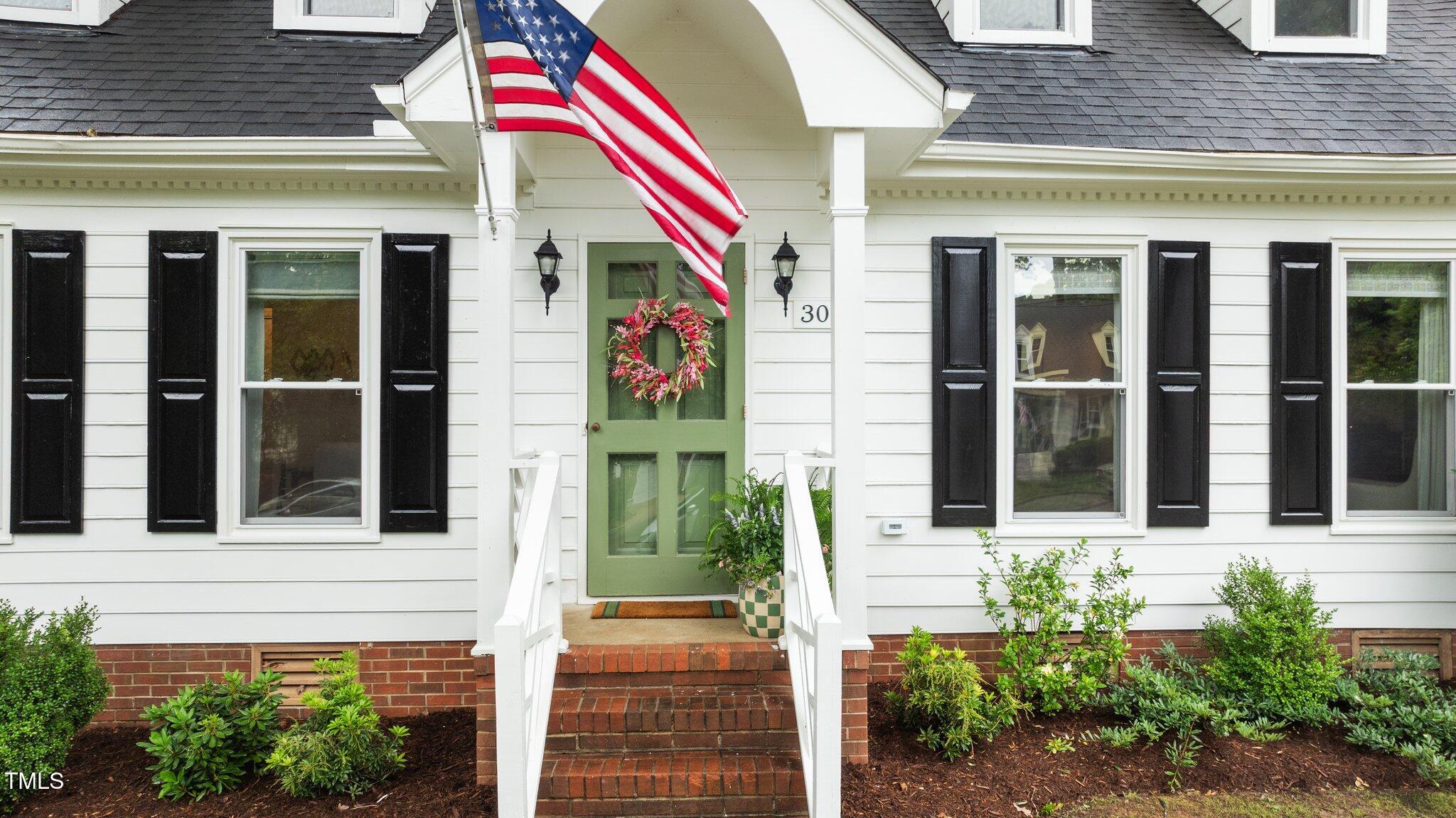 3016 Bolo Trail Raleigh, NC 27615 - Photo 26 of 28 a front view of a house with a garden