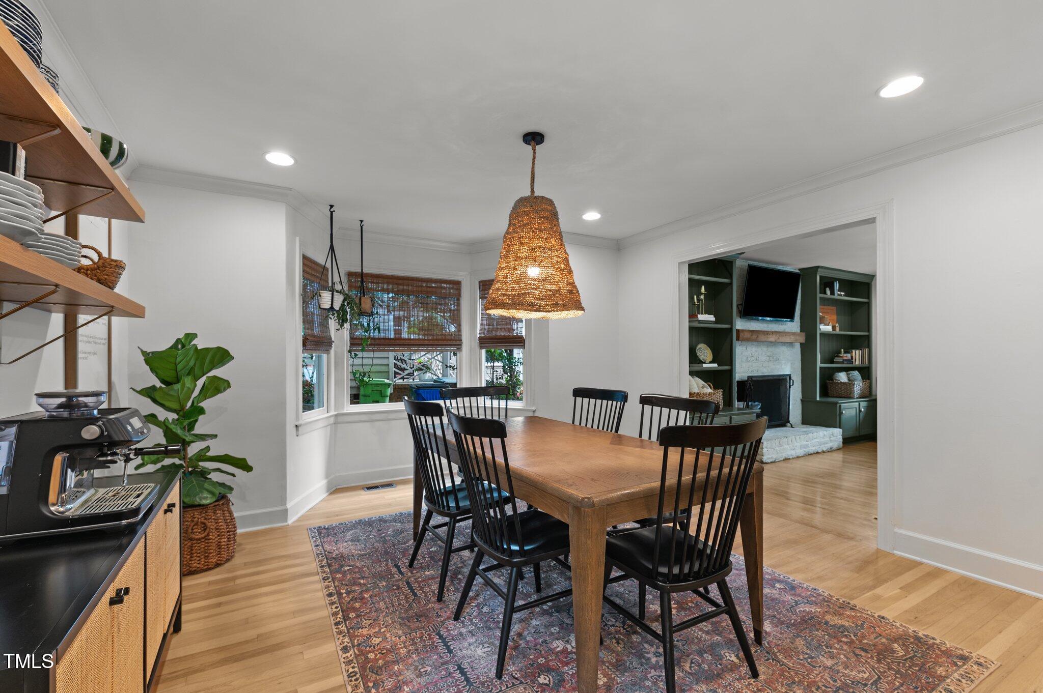 3016 Bolo Trail Raleigh, NC 27615 - Photo 9 of 28 a dining room with furniture window and wooden floor