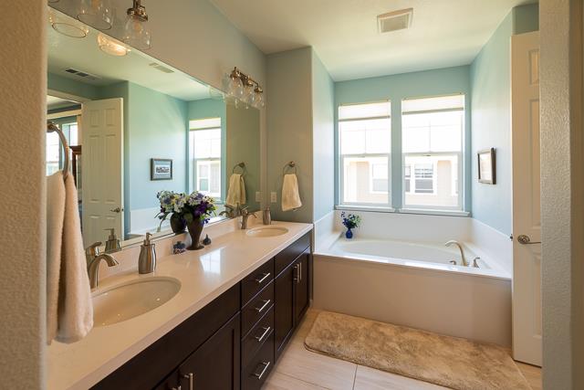 107 Wallace Circle Moraga, CA 94556 - Photo 12 of 18 a bathroom with a tub double sink window and mirror