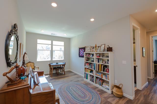 107 Wallace Circle Moraga, CA 94556 - Photo 13 of 18 a living room with lots of furniture and a book shelf