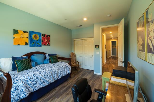 107 Wallace Circle Moraga, CA 94556 - Photo 17 of 18 a bedroom with a bed and wooden floor