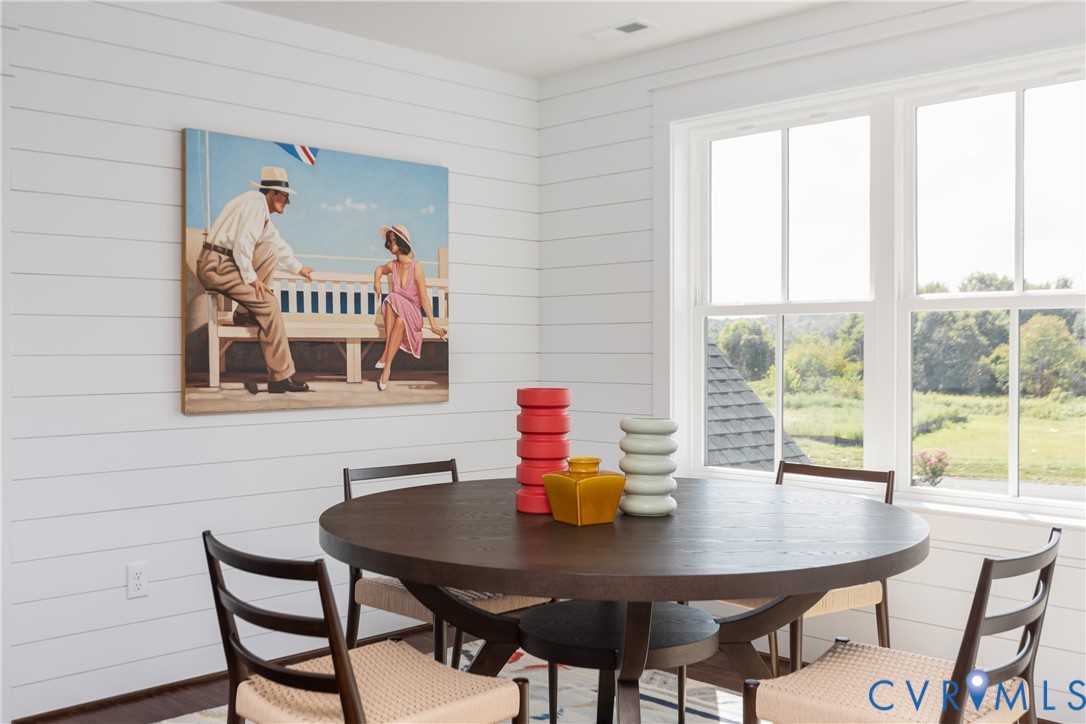 16852 Sheppards Fold Way Beaverdam, VA 23015 - Photo 24 of 30 a view of a dining room with furniture a chandelier and wooden floor