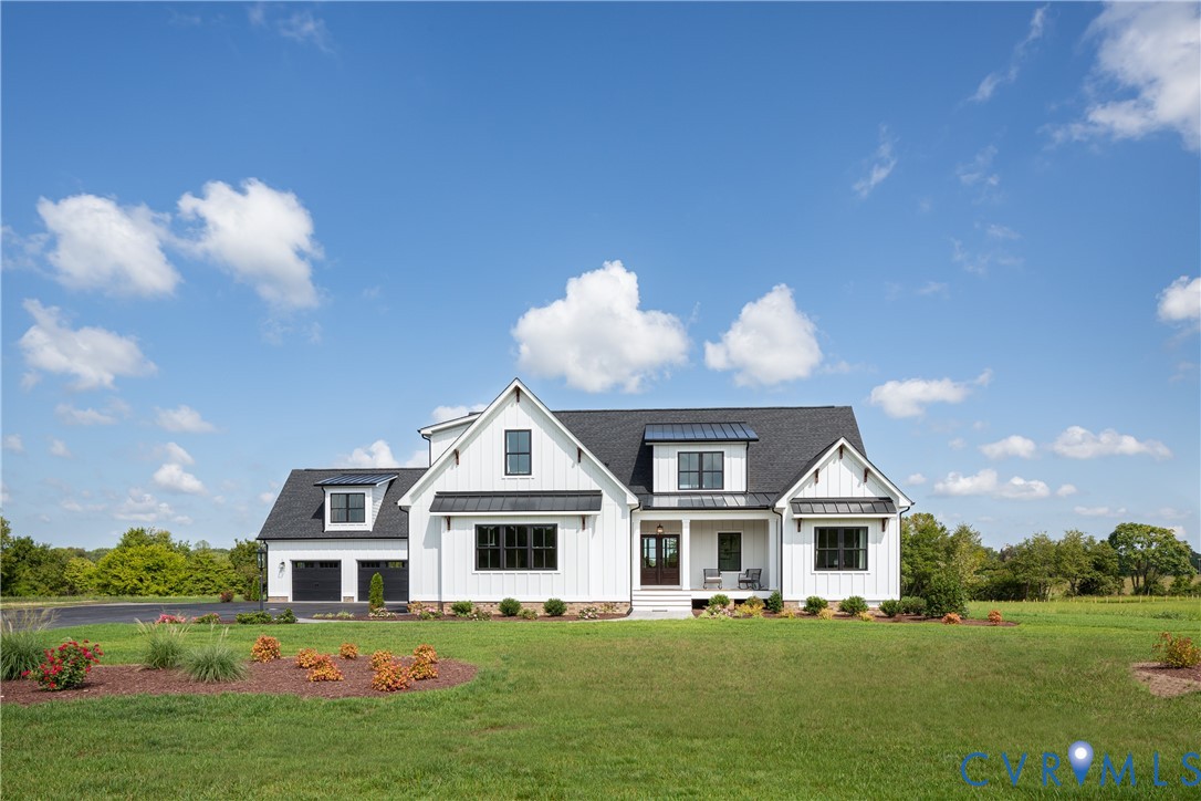 16852 Sheppards Fold Way Beaverdam, VA 23015 - Photo 30 of 30 a front view of a house with a garden and trees