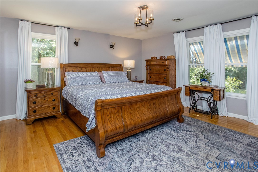 20808 Little Road Petersburg, VA 23803 - Photo 11 of 35 Huge Primary bedroom with hardwood flooring, light