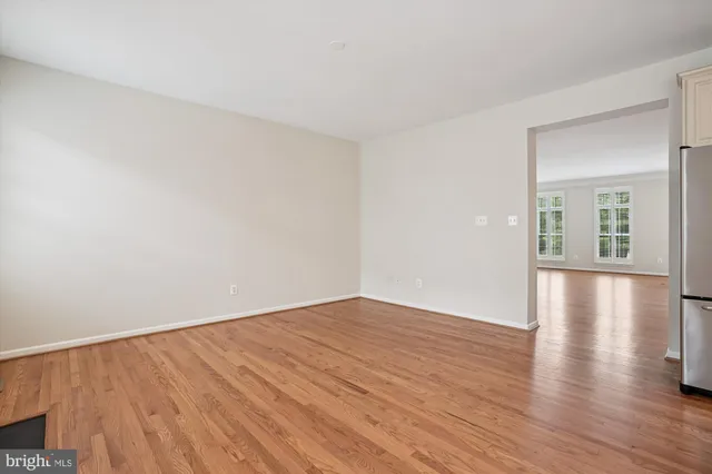 a kitchen with cabinets and stainless steel appliances