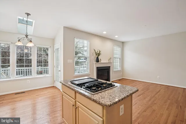 a view of a room with windows and chandelier