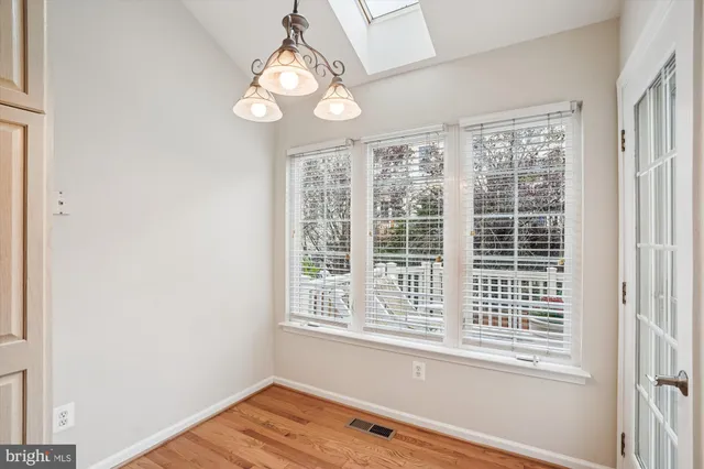 a bathroom with a sink mirror and toilet