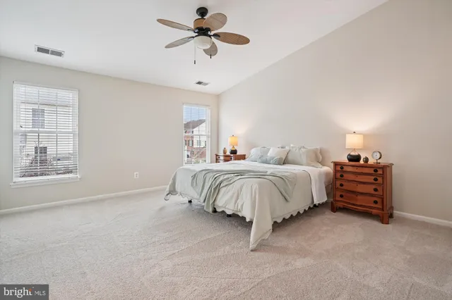 a bed room with a bed and a chandelier