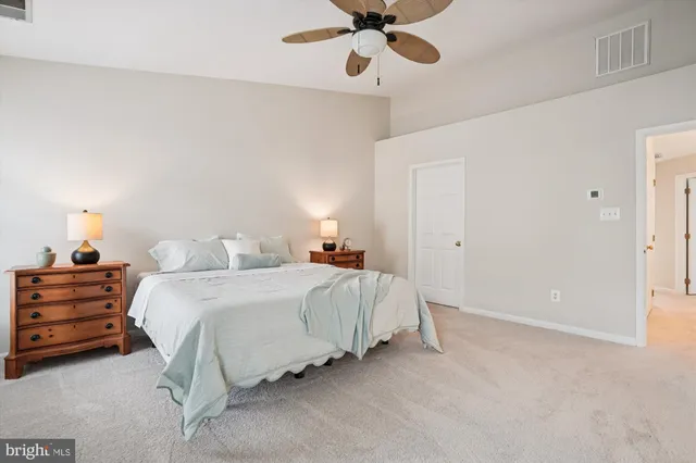 a bathroom with a sink double vanity mirror and a bathtub