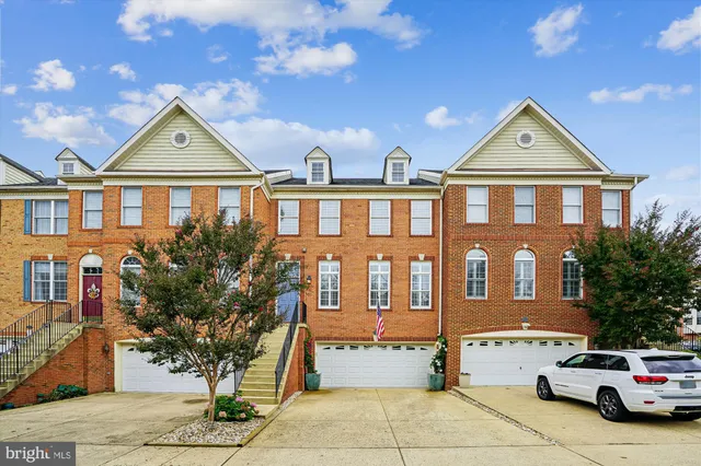 a view of a car parked in front of a brick house