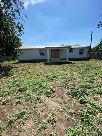 a view of a swimming pool and an outdoor space