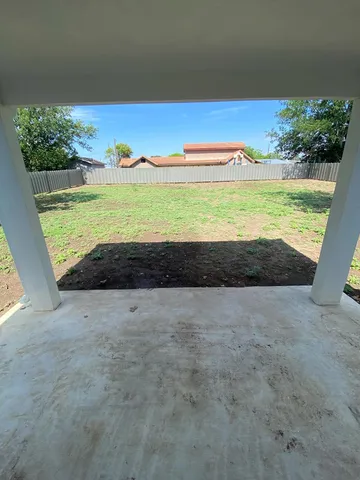 a view of a field with an ocean