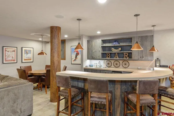 a kitchen with a table and chairs in it