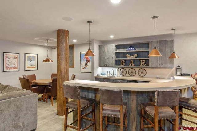 a kitchen with a table and chairs in it