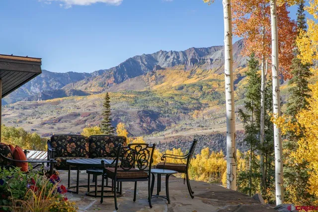 a view of a chairs and table on the terrace