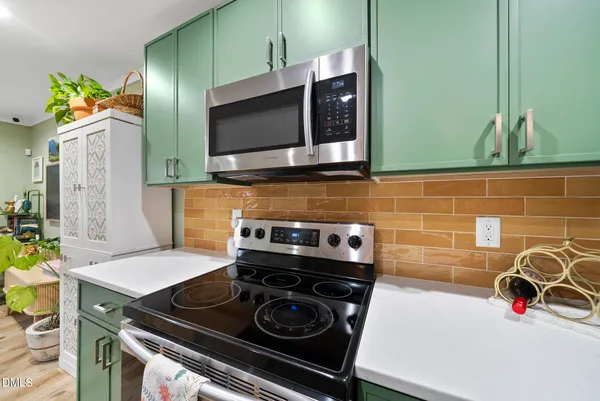a kitchen with a stove and a microwave