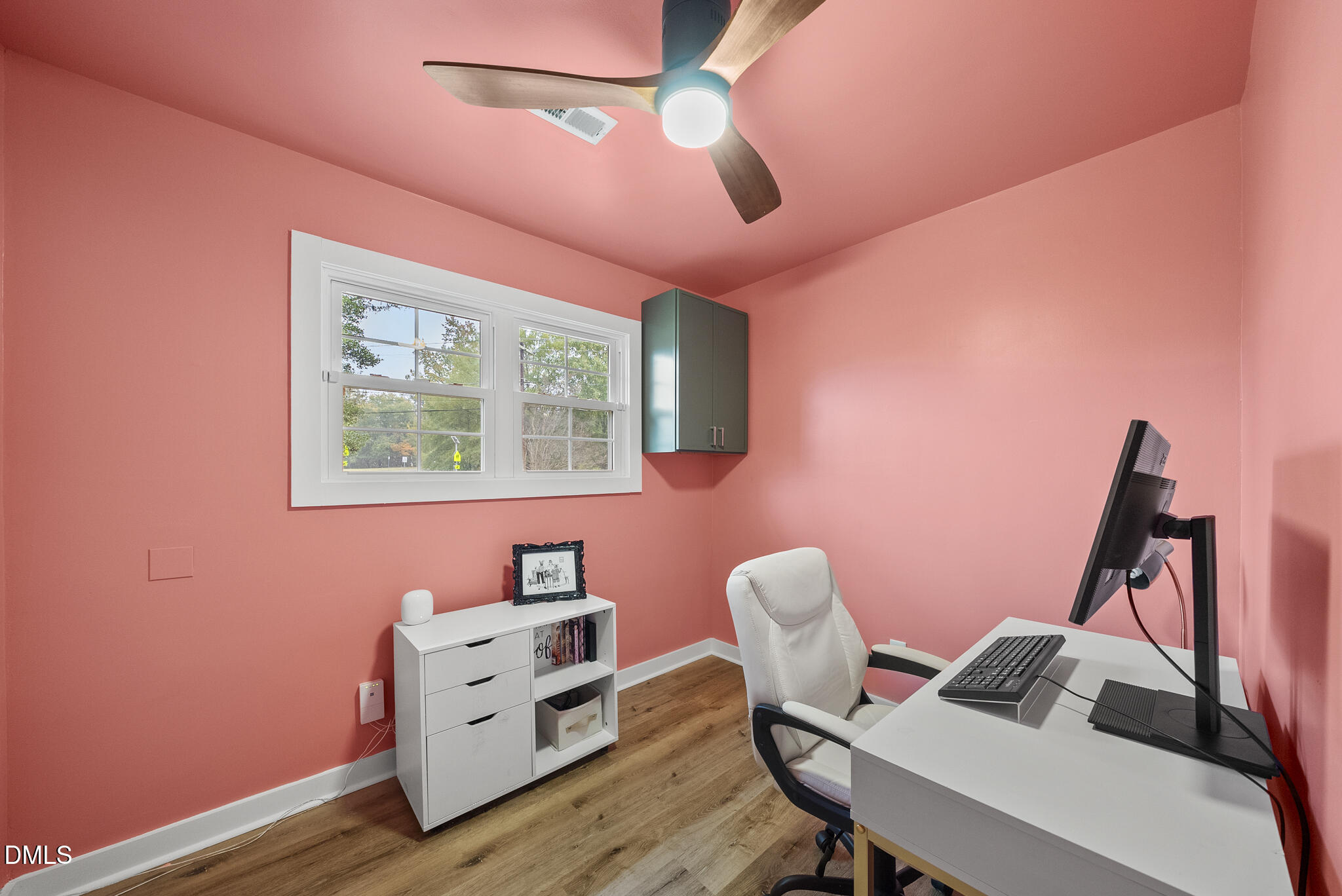 1002 Bacon Street Durham, NC 27703 - Photo 17 of 31 a view of a workspace with furniture and wooden floor