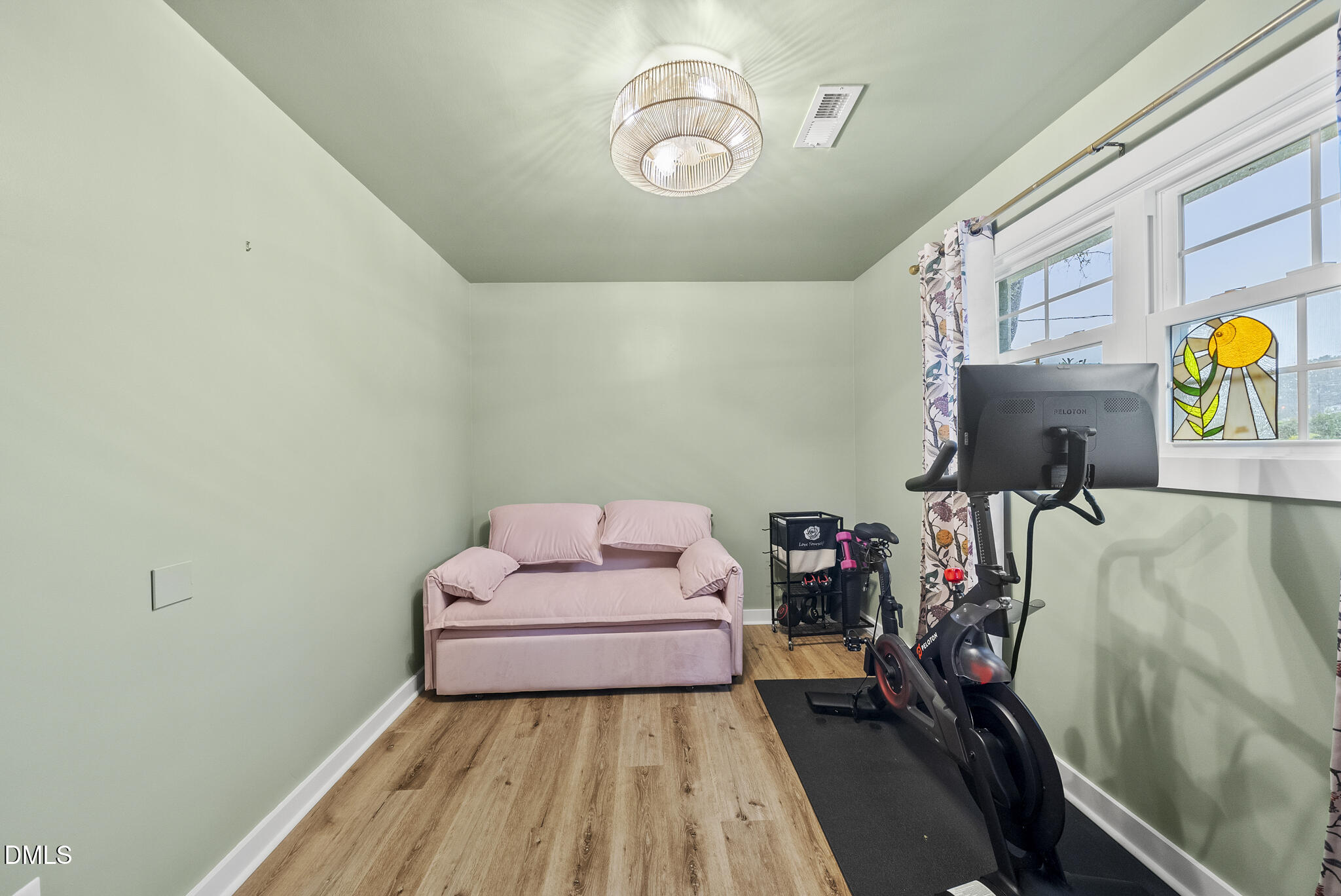 1002 Bacon Street Durham, NC 27703 - Photo 20 of 31 a bedroom with a bed and wooden floor