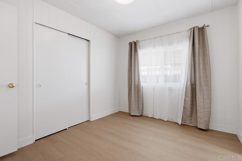 650 South Rancho Santa Fe Road, Unit 291 San Marcos, CA 92078 - Photo 23 of 48 a view of an empty room with a glass door