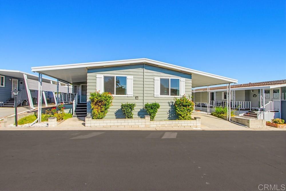 650 South Rancho Santa Fe Road, Unit 291 San Marcos, CA 92078 - Photo 28 of 48 a front view of a house with a swimming pool