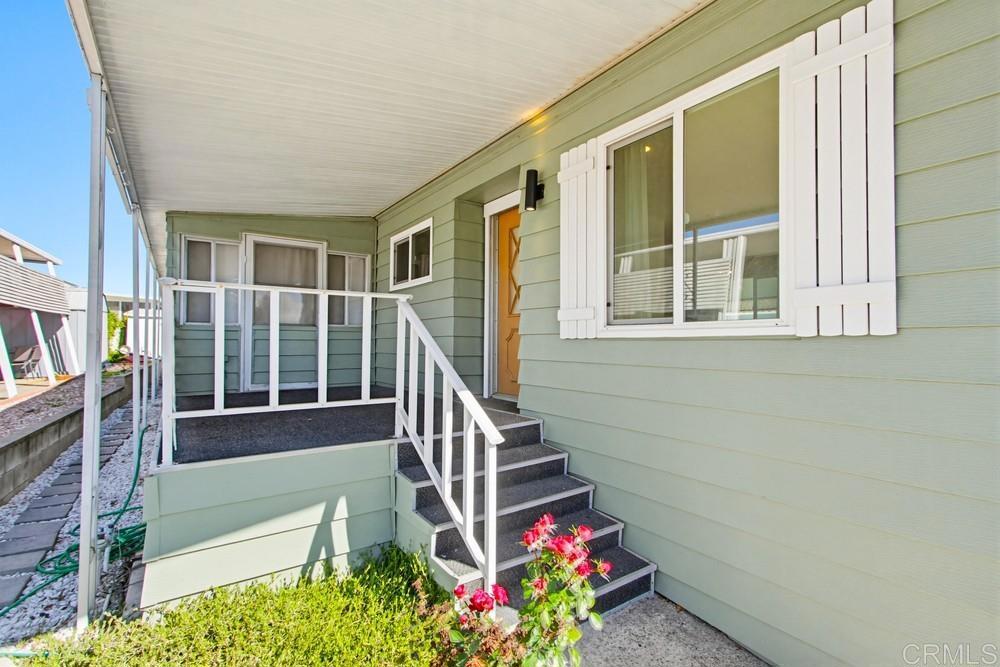 650 South Rancho Santa Fe Road, Unit 291 San Marcos, CA 92078 - Photo 29 of 48 a house with beautiful flower in front of it