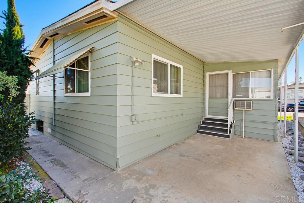 650 South Rancho Santa Fe Road, Unit 291 San Marcos, CA 92078 - Photo 33 of 48 a view of a house with backyard and wooden fence