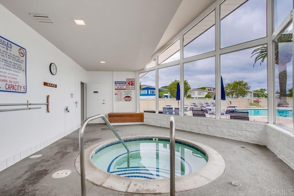 650 South Rancho Santa Fe Road, Unit 291 San Marcos, CA 92078 - Photo 38 of 48 a room with lots of table and chairs