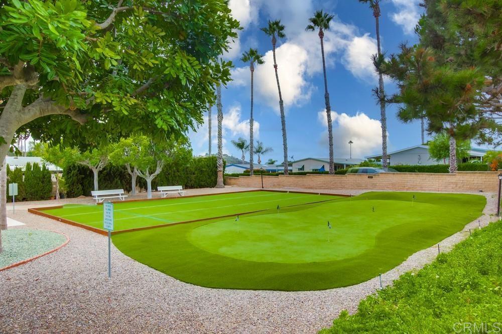 650 South Rancho Santa Fe Road, Unit 291 San Marcos, CA 92078 - Photo 40 of 48 a view of a swimming pool with a yard and trees