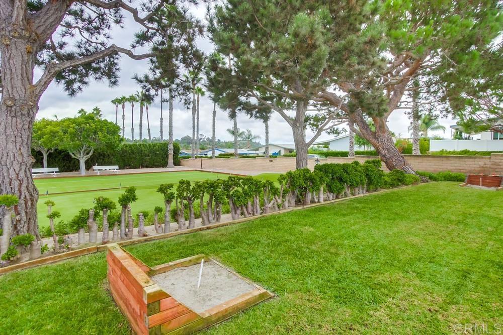 650 South Rancho Santa Fe Road, Unit 291 San Marcos, CA 92078 - Photo 41 of 48 a view of backyard with swimming pool and green space