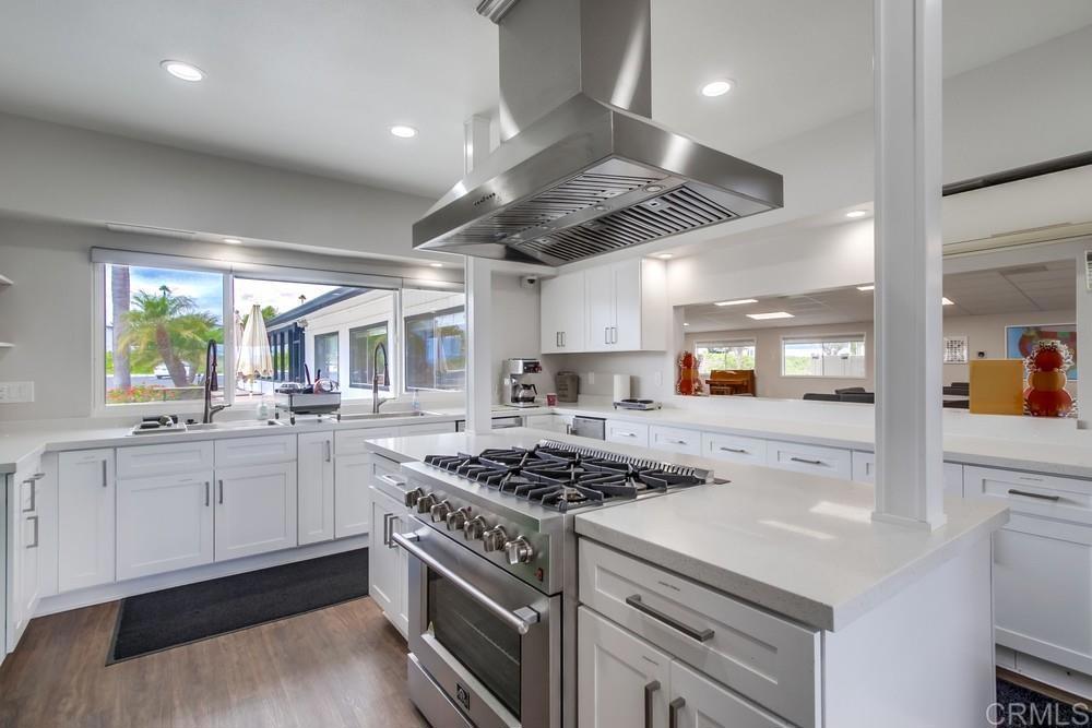 650 South Rancho Santa Fe Road, Unit 291 San Marcos, CA 92078 - Photo 43 of 48 a kitchen with stainless steel appliances a sink a stove and cabinets