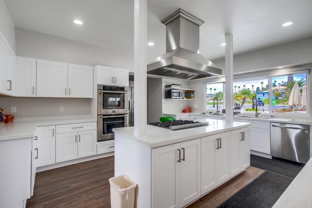650 South Rancho Santa Fe Road, Unit 291 San Marcos, CA 92078 - Photo 44 of 48 a kitchen with stainless steel appliances granite countertop a sink and cabinets