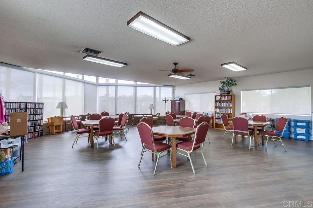650 South Rancho Santa Fe Road, Unit 291 San Marcos, CA 92078 - Photo 45 of 48 a view of a dining area with furniture window and wooden floor
