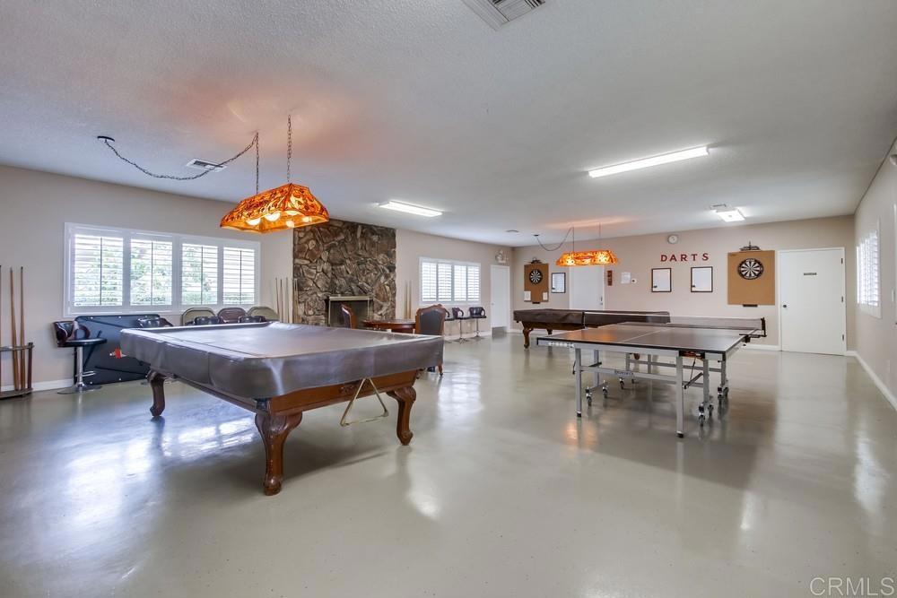 650 South Rancho Santa Fe Road, Unit 291 San Marcos, CA 92078 - Photo 47 of 48 a living room with furniture a table and a large window