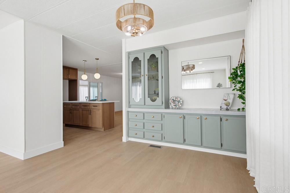 650 South Rancho Santa Fe Road, Unit 291 San Marcos, CA 92078 - Photo 7 of 48 a view of a double vanity sink a mirror a window and a lamp
