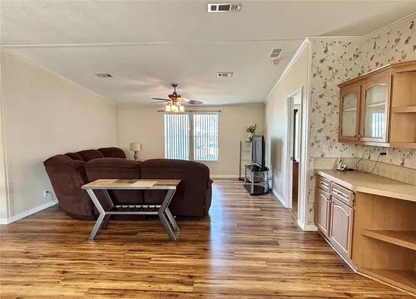 a living room with furniture a dining table and chairs