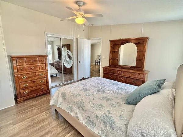 a bedroom with a bed and a dresser