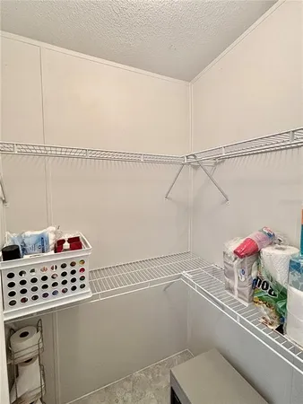 a kitchen with a white cabinets and white appliances