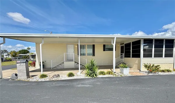a front view of a house with a outdoor space