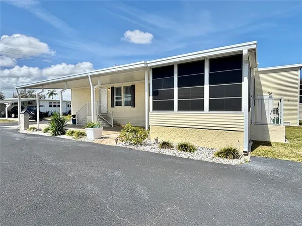 a view of a house with a sitting area and garage