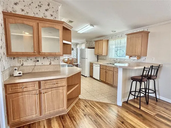 a kitchen with stainless steel appliances granite countertop a sink and cabinets