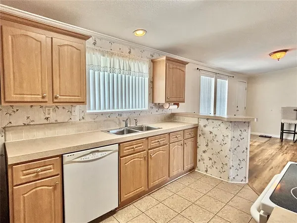 a view of a kitchen with cabinets