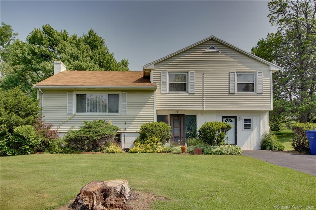 10 Sycamore Road Bloomfield, CT 06002 - Photo 1 of 1 a front view of a house with a garden