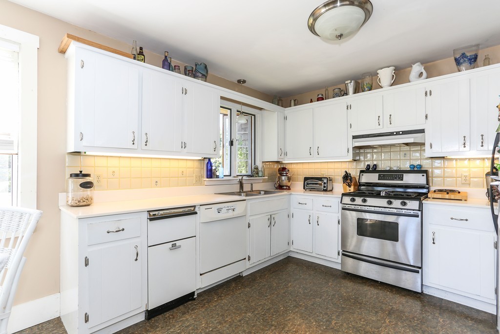 75 Deacon Court Barnstable, MA 02630 - Photo 12 of 30 a kitchen with cabinets appliances and a sink