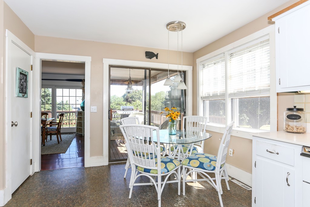 75 Deacon Court Barnstable, MA 02630 - Photo 13 of 30 a view of a dining room with furniture large windows and wooden floor