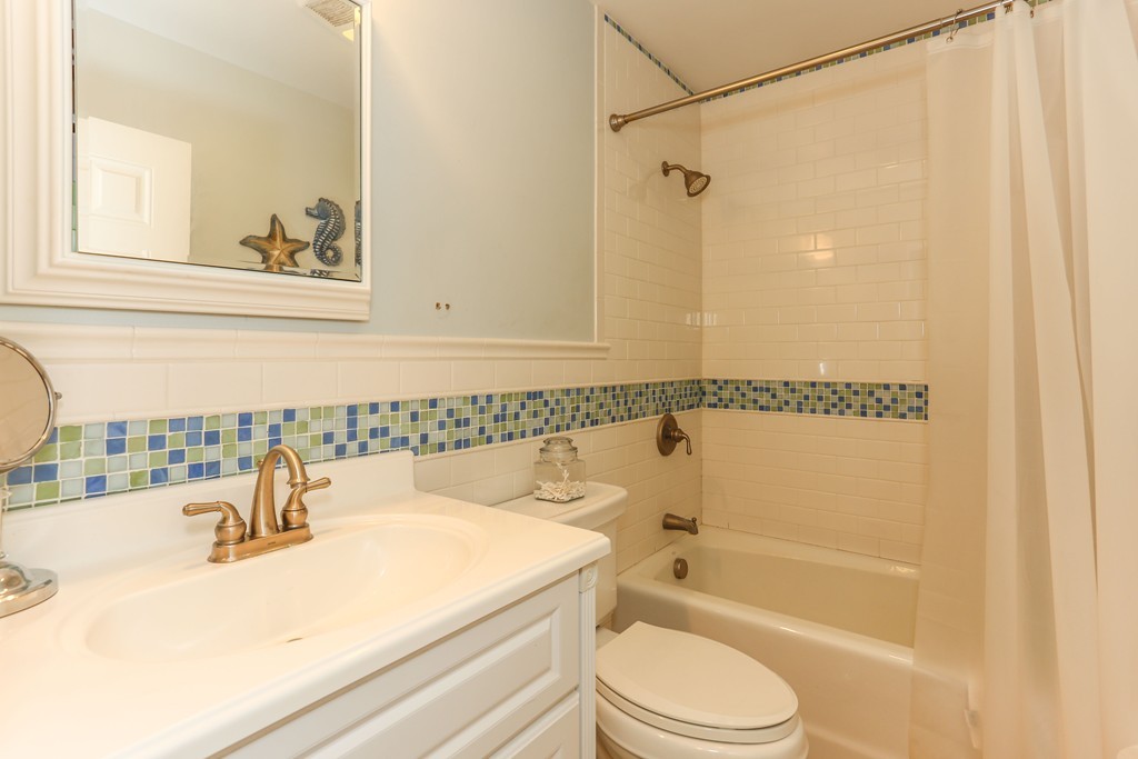 75 Deacon Court Barnstable, MA 02630 - Photo 18 of 30 a bathroom with a sink a toilet and a bathtub