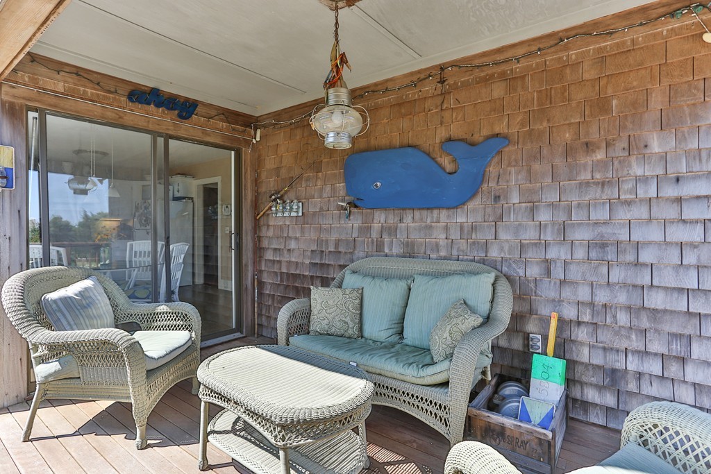 75 Deacon Court Barnstable, MA 02630 - Photo 26 of 30 a living room with furniture a table and a potted plant