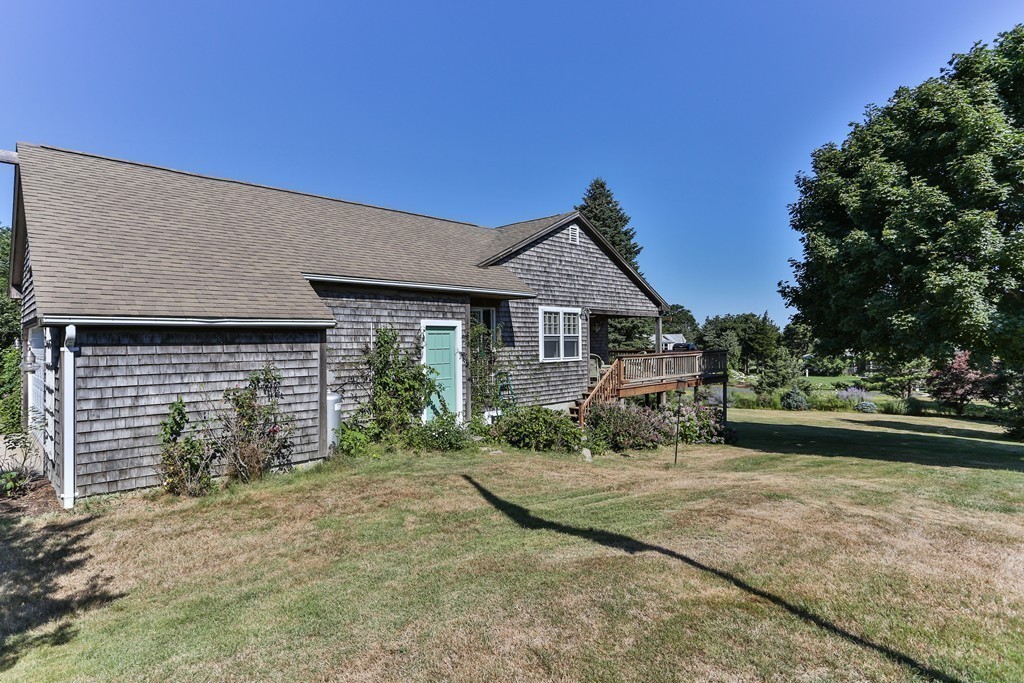 75 Deacon Court Barnstable, MA 02630 - Photo 3 of 30 a front view of a house with garden