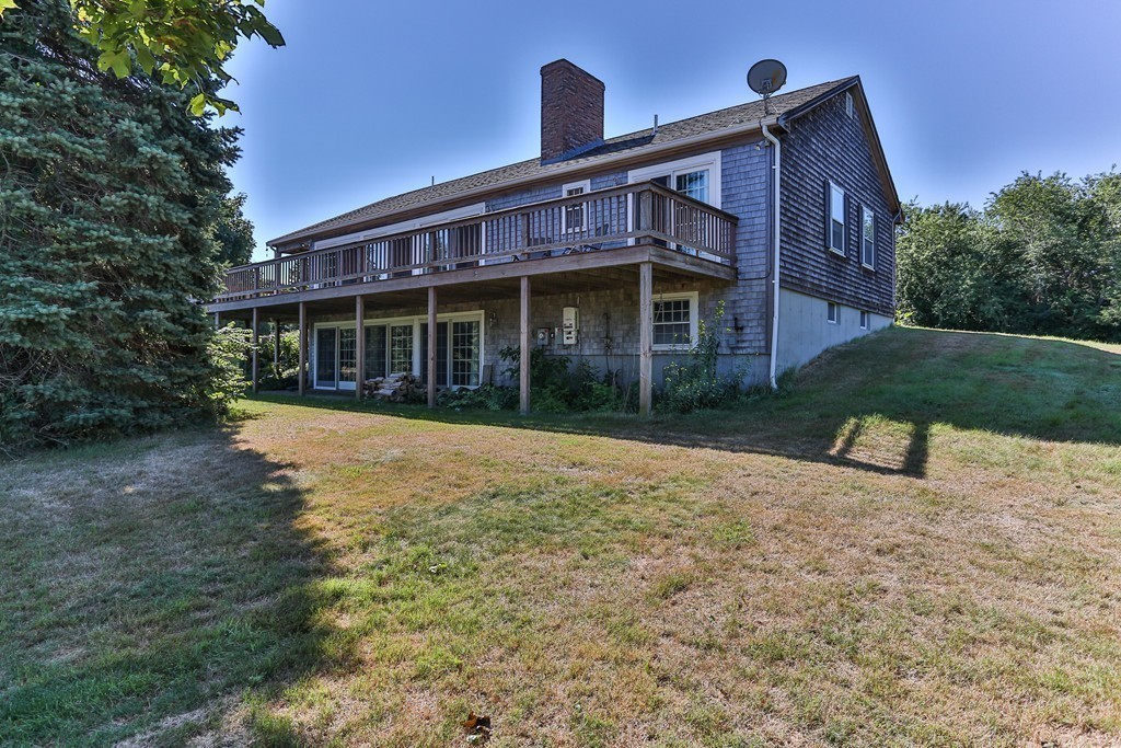 75 Deacon Court Barnstable, MA 02630 - Photo 5 of 30 a front view of a house with a yard