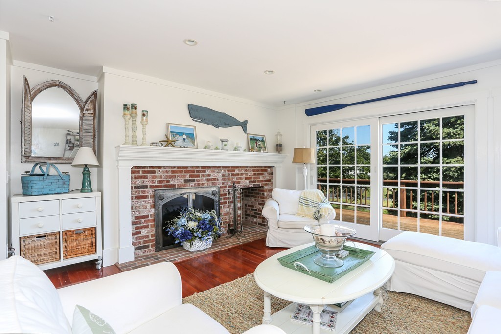75 Deacon Court Barnstable, MA 02630 - Photo 9 of 30 a living room with furniture and a fireplace
